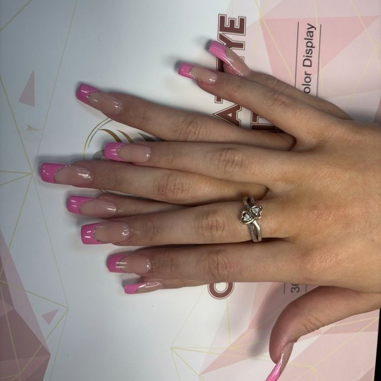 Long pink French tips with a fine glitter line